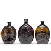 Five Molded Glass Amber Flasks