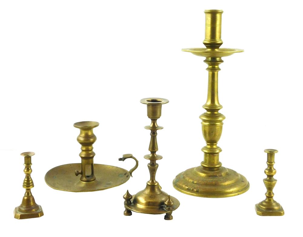 FIVE ODD BRASS CANDLESTICKS: