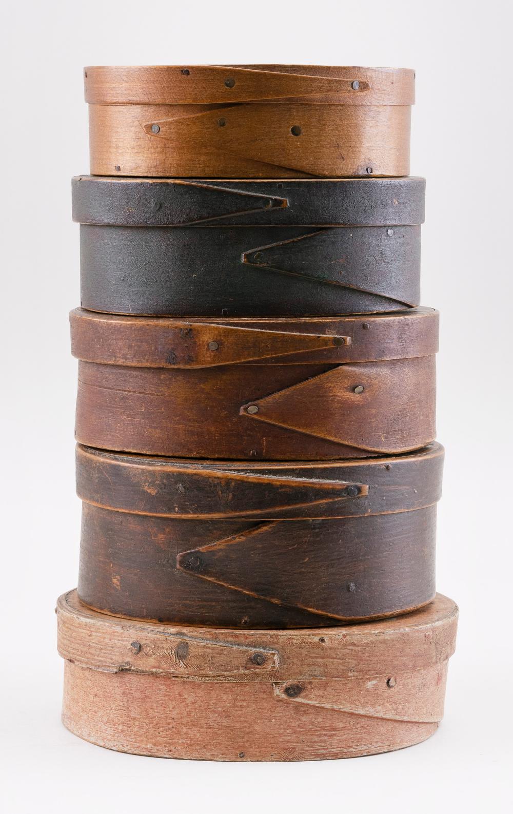 FIVE OVAL FINGER-LAPPED WOODEN