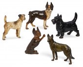 FIVE PAINTED CAST IRON DOG FOR