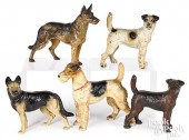 FIVE PAINTED CAST IRON DOG DOO