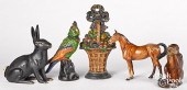 FIVE PAINTED CAST IRON DOORSTO