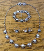 FIVE PIECE ANTIQUE PEARL AND S