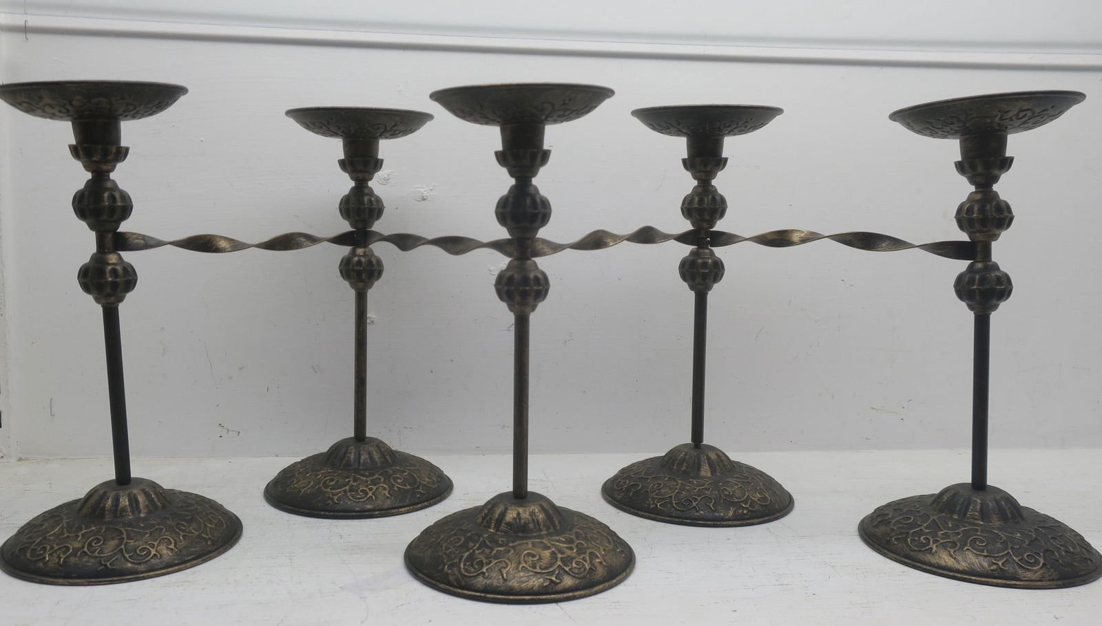 FIVE PIECE METAL CANDLESTICKS
