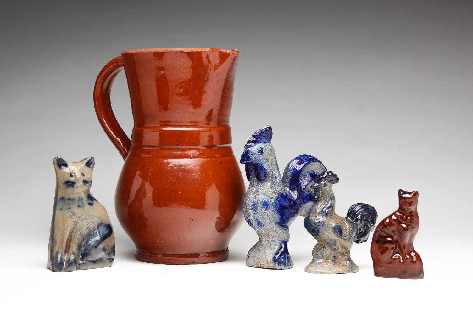 FIVE PIECES OF REDWARE AND