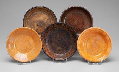 Five redware bowls: varying
