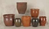Five redware crocks 19th c. to