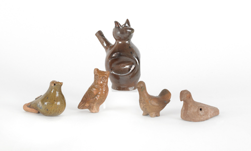 Five redware figural whistles