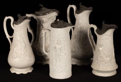 Five saltware jugs, decorated