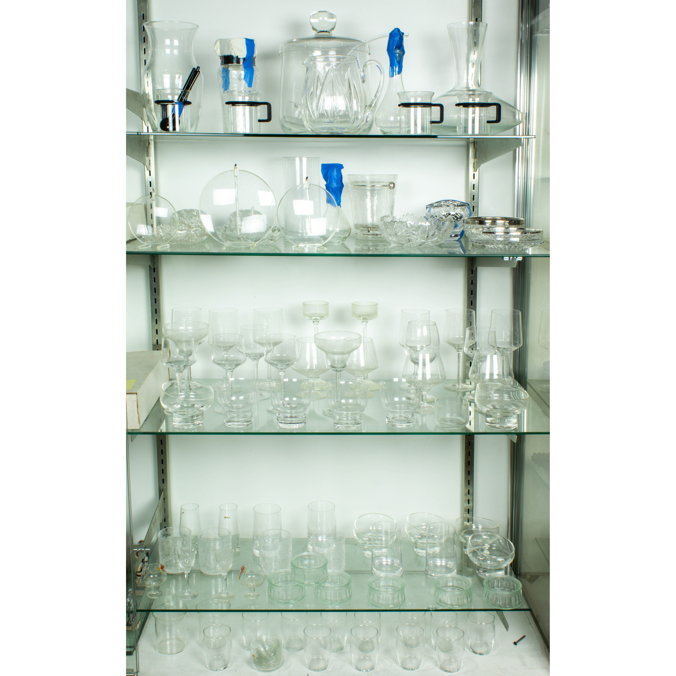 FIVE SHELVES OF GLASSWARE Five
