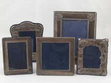 Five silver photo frames largest 14