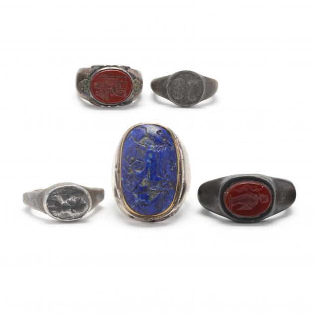 FIVE SILVER-TONED RINGS AFTER