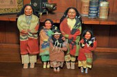 FIVE SKOOKUM DOLLS. Including