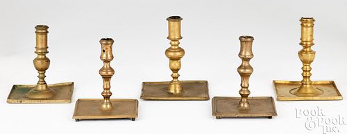 FIVE SPANISH BRASS CANDLESTICKSFive