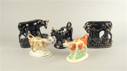 Five Staffordshire cow figure
