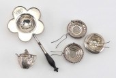 FIVE STERLING SILVER TEA STRAI
