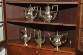 FIVE STERLING TEAPOTS. All mar