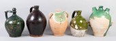 FIVE TALL GLAZED POTTERY JUGS,