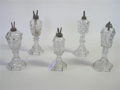 Five uncolored pressed glass