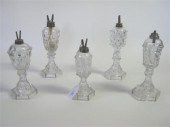 Five uncolored pressed glass f