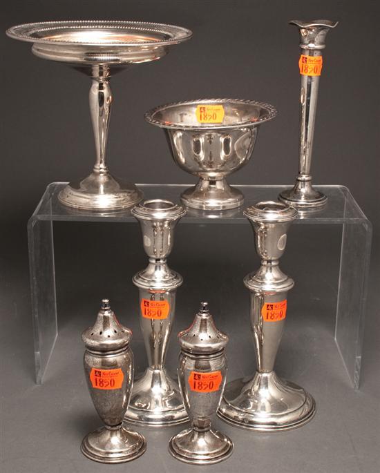 Five weighted-silver table