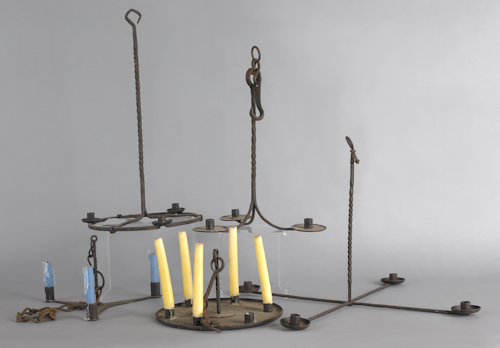 Five wrought iron chandeliers