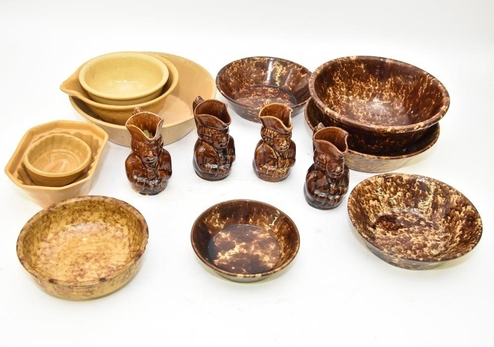 Five yellow ware bowls, largest
