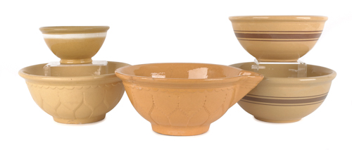 Five yelloware mixing bowls late