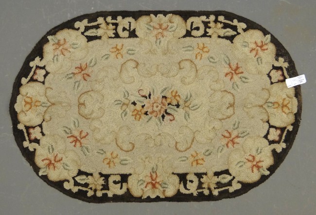 Floral hooked rug.