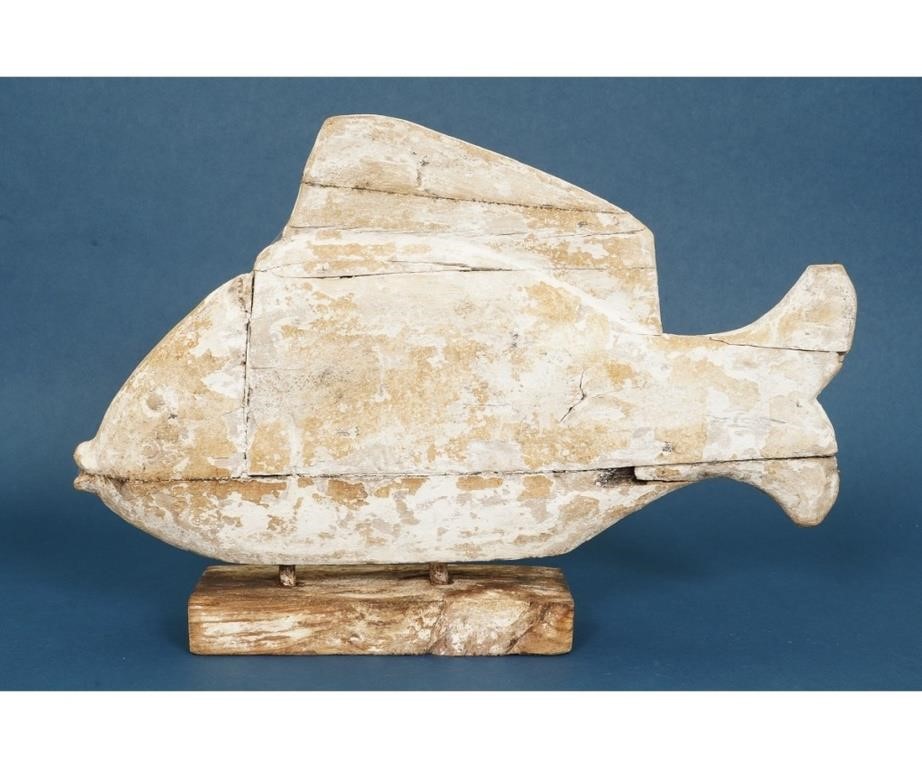 Folk art carved fish mounted on a