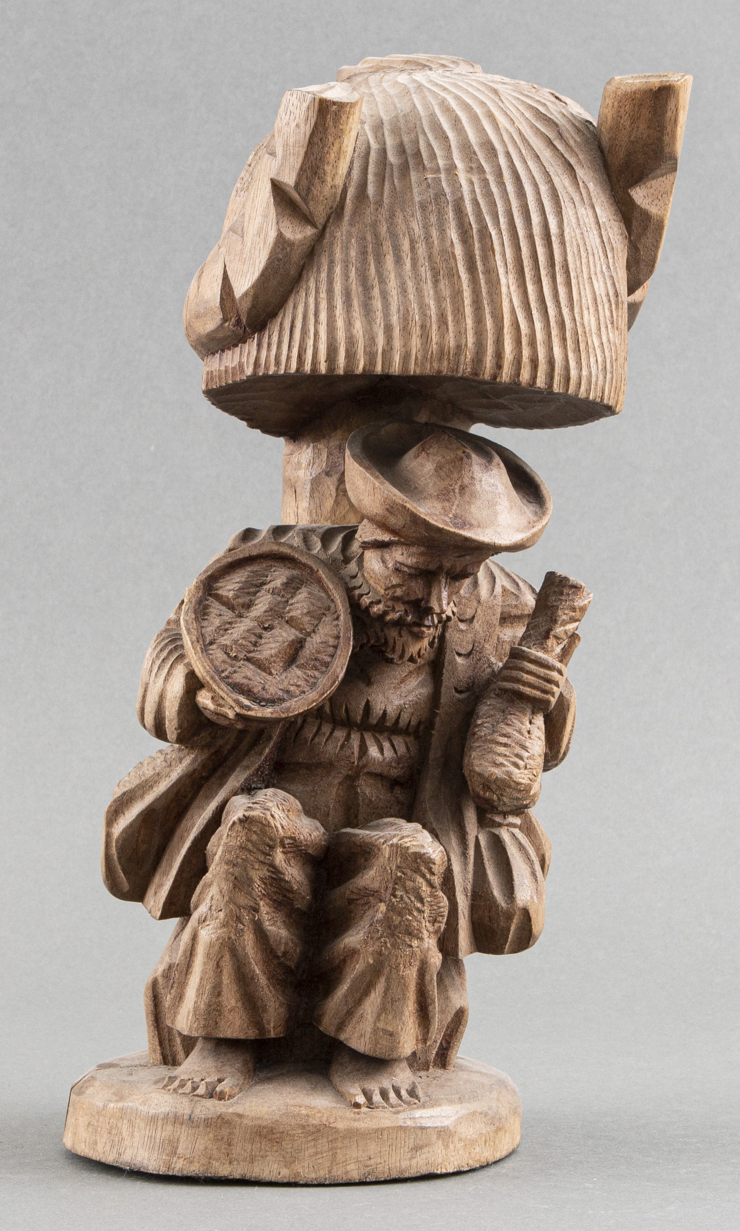 FOLK ART CARVED WOOD SCULPTURE OF A