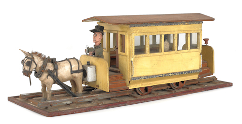Folk art carved wooden train car on