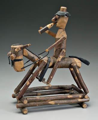 Folk art figure of horse and rider,