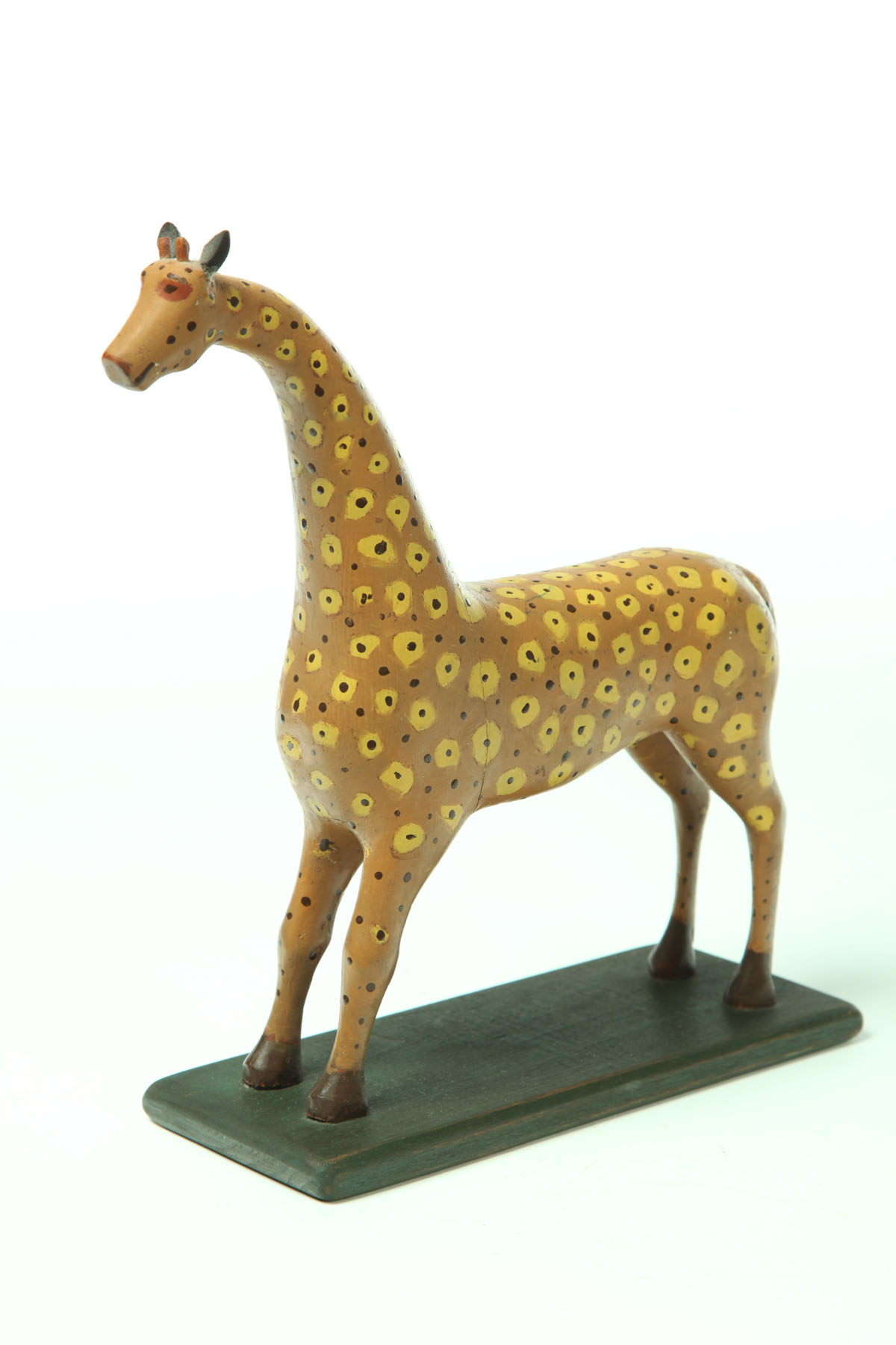 FOLK ART GIRAFFE CARVING.  American