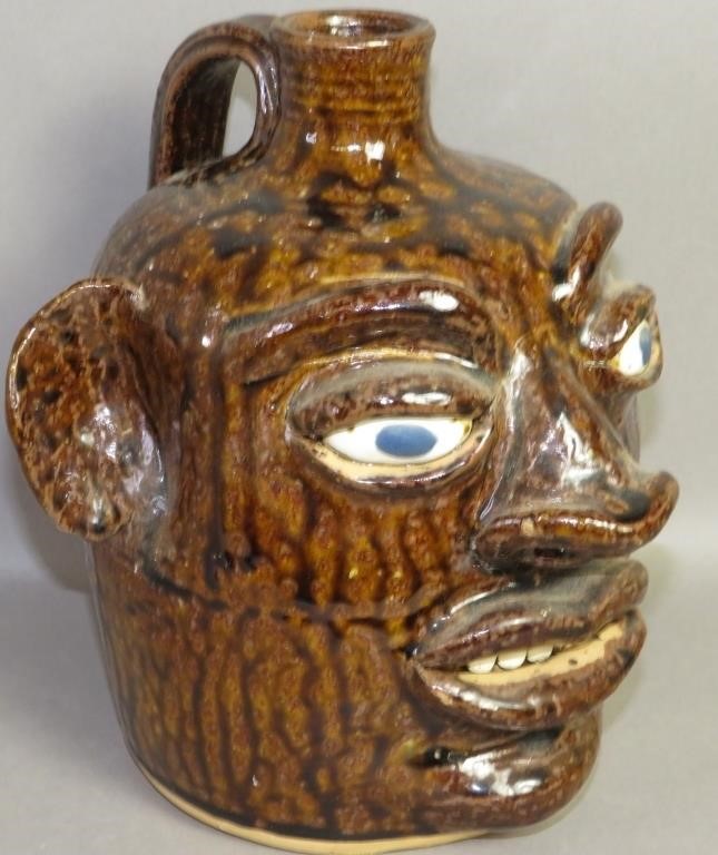FOLK ART POTTERY FACE JUG BY