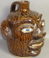 FOLK ART POTTERY FACE JUG BY W