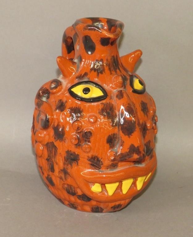 FOLK ART REDWARE FACE JUG BY