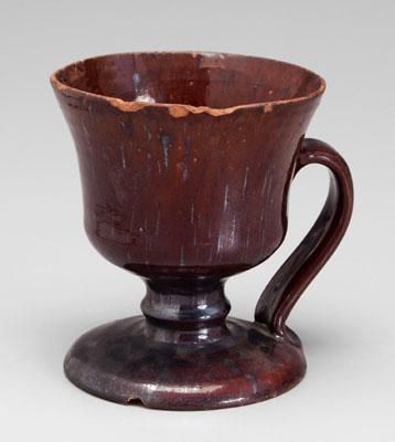 Footed redware mug, runny brown
