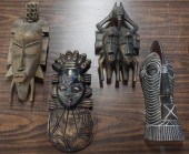 FOUR AFRICAN CARVED WOOD MASKS