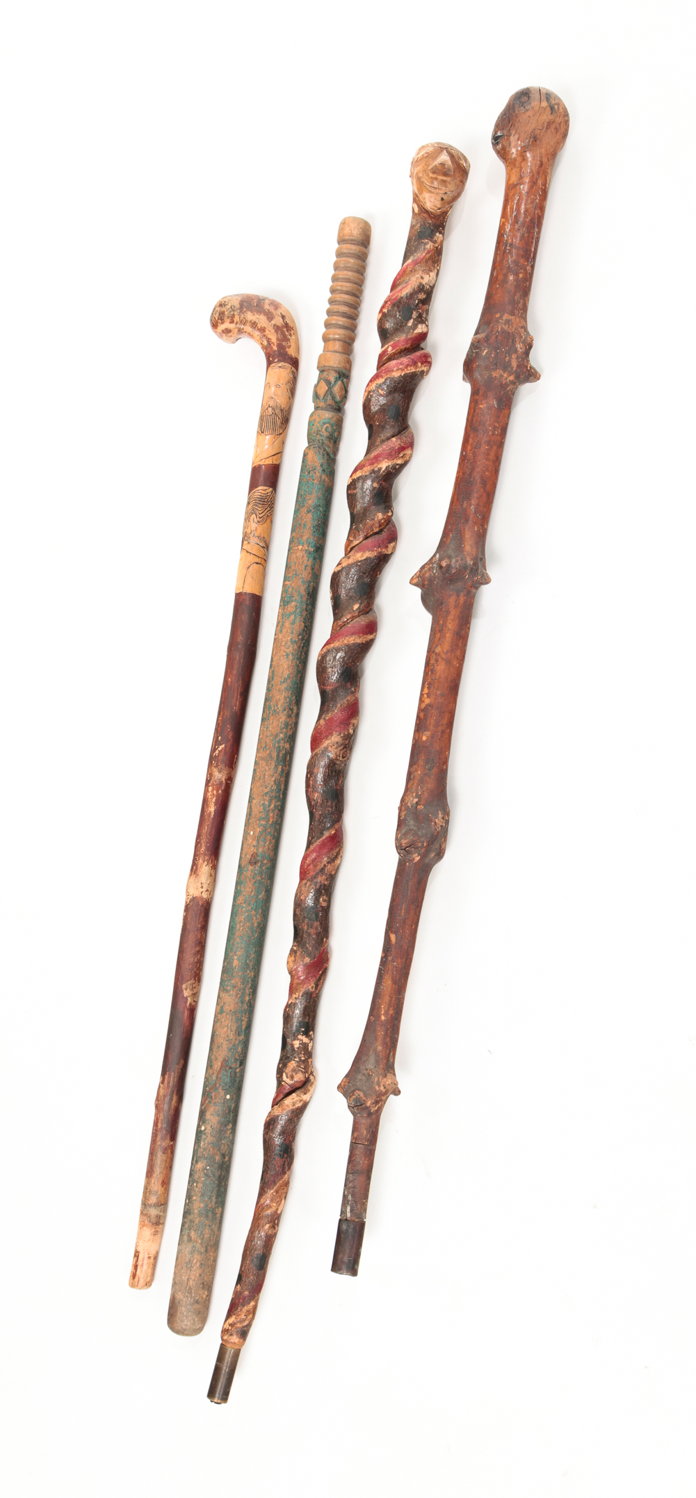 FOUR AMERICAN FOLK ART CANES. First