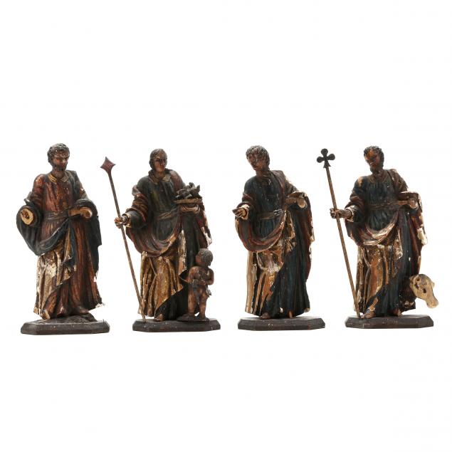 FOUR ANTIQUE CARVED WOOD SANTOS