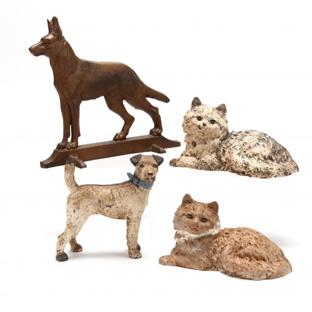 FOUR ANTIQUE CAST IRON ANIMAL
