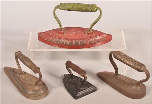 FOUR ANTIQUE CAST IRON FLAT