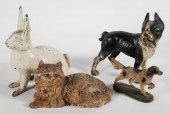 FOUR ANTIQUE CAST IRONS ANIMAL