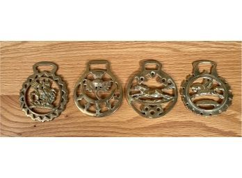 Four antique horse brass, various