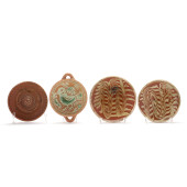 FOUR ANTIQUE REDWARE SLIP DECO