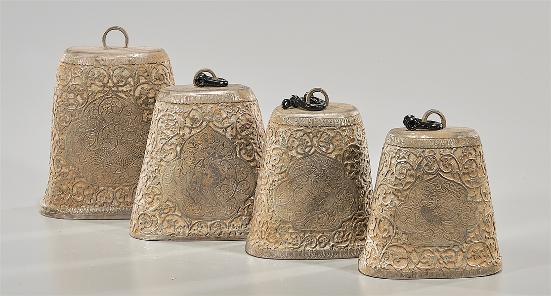 Four archaistic metal bells; each