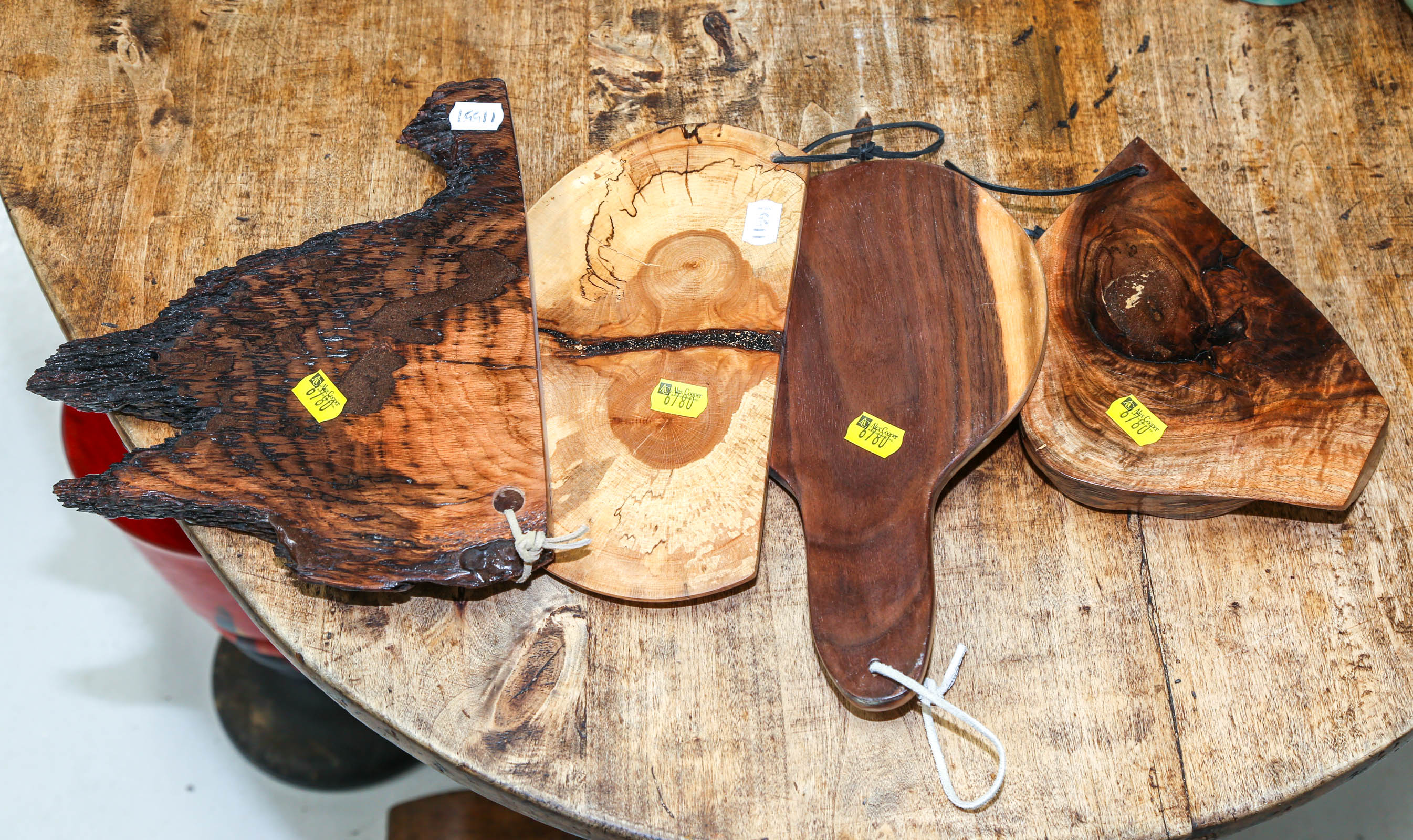 FOUR ARTISAN WOOD CUTTING BOARDS .