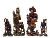 Four Asian wooden figures incl