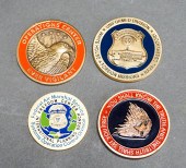 FOUR ASSORTED CHALLENGE COINS